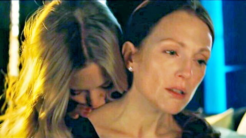 Blonde woman nuzzling brunette's neck in intimate movie sex scene