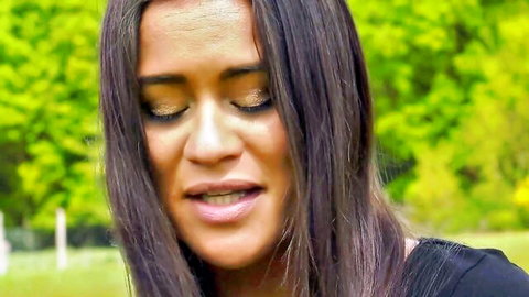 Seductive brunette woman outdoors in black top, adult film thumbnail