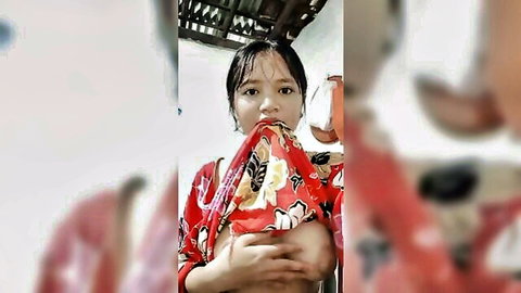 Indonesian beauty with wet hair teasing breasts in red floral dress