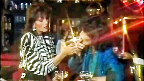 Teresa Orlowski in intimate bar tease with curly-haired man