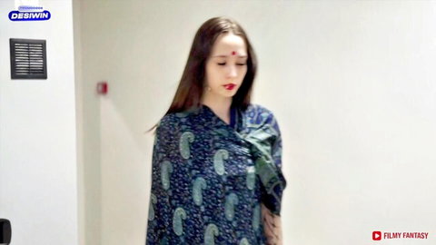 Sexy Indian housewife in paisley dupatta standing seductively in room