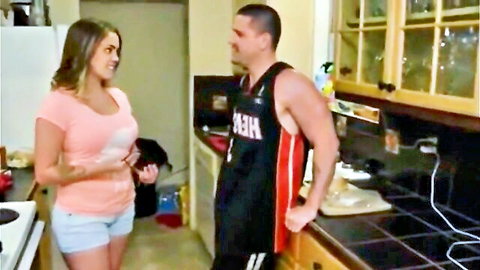 Katie Cummings in pink tank top and shorts flirting with muscular guy in kitchen