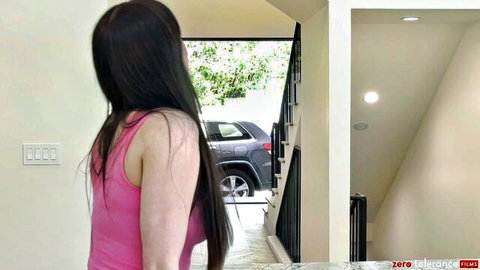 Brunette in pink tank top at doorway with car outside, Dorian & Fae PTM