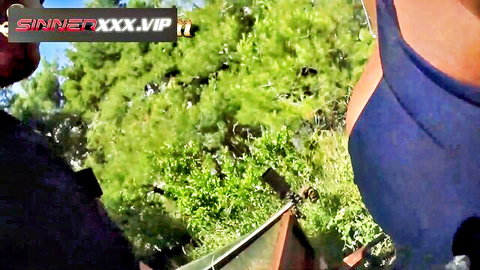 Kiki Minaj ebony model in blue top outdoors in paradise setting