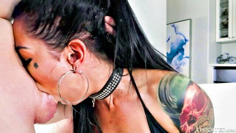 Katrina Jade in intense kiss with tattoos and choker necklace