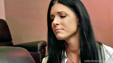 Brunette beauty with long hair in white blouse gazing intently in lesbian scene