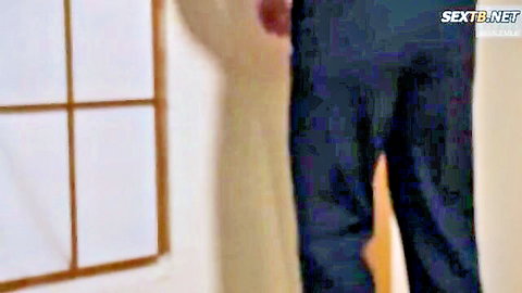 Japanese man in dark jeans standing by shoji window in homemade adult video