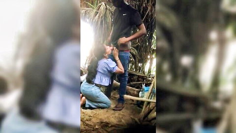 Sri Lankan beauty kneels for outdoor blowjob in jeans and top