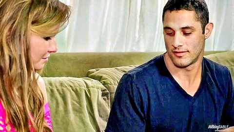 Blonde Melissa May in intimate gaze with handsome guy on couch