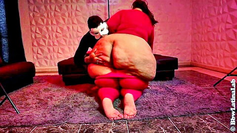 Thick redhead Latina with massive ass in tight red leggings, grabbed by masked man from behind