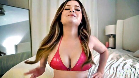 Curvy Latina in shiny red bikini top smiling seductively for JOI