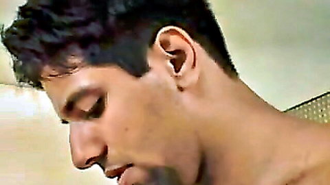 Closeup of handsome bearded South Asian man looking down intensely in amateur Indian porn
