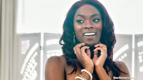 Ana Foxxx as seductive ebony bride smiling teasingly in wedding attire