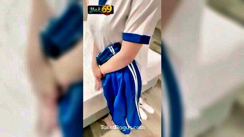 Slim Asian twink in school uniform teasing hand in blue shorts
