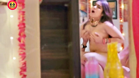 Desi Indian woman topless, covering breasts in ecstasy, Jalan Hunters hot Hindi series