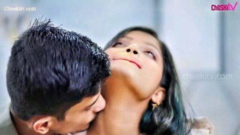Passionate Indian couple in neck kiss embrace, woman tilting head back