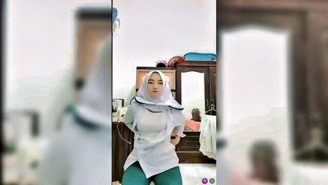 Sexy Asian nurse in hijab posing provocatively