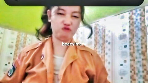 Malay hijab scout girl Becky Liman with big tits pouting in uniform