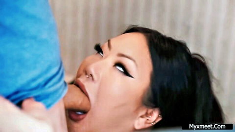 Asian stepmom with sultry eyes giving intense blowjob close-up