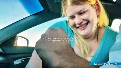 Blonde BBW smiles with BBC arm around her in car