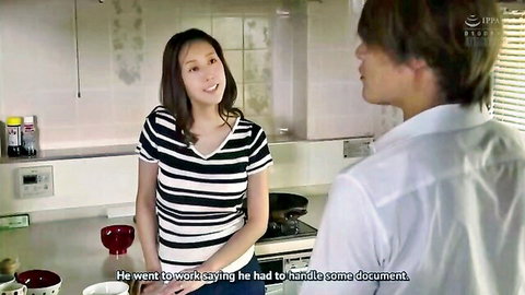 Asian brunette woman in striped shirt smiling at man in kitchen during casual conversation