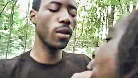 Candy Fuller close intimate kiss with black man in forest
