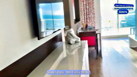 Luxury hotel room interior with ocean view balcony, white towels on red chair desk and marble counter
