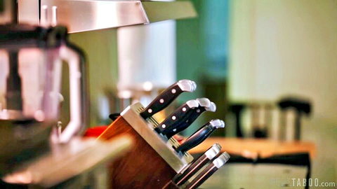 Reagan Foxx kitchen knives in sharp closeup domestic tease