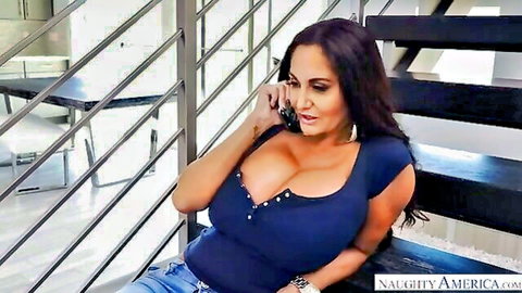 Ava Addams busty brunette with deep cleavage in blue top and jeans