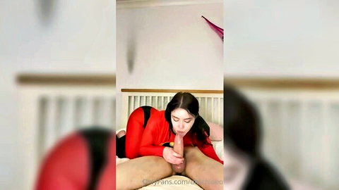 Okiichloeo in red latex suit giving intense blowjob closeup