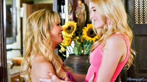 Blonde mature lesbian mom embracing young daughter intimately