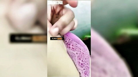 Indonesian woman in pink lace panties with teasing hand close-up