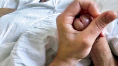 Man's hand spreads open wet pink pussy lips exposing tight vaginal hole closeup