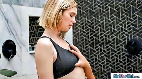 Blonde tomboy GF in steamy shower, hand on breast, post-sweat vibe