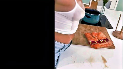 Latina girlfriend teases small tits through sheer white top and low jeans in kitchen