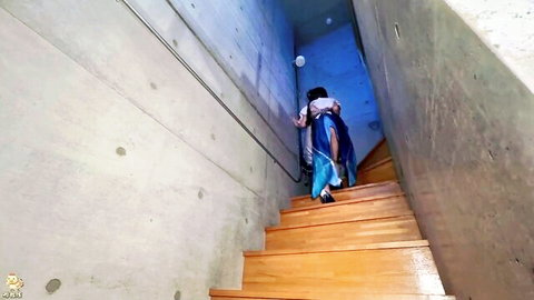 Petite anime cosplay babe in blue skirt walking up stairs teasingly