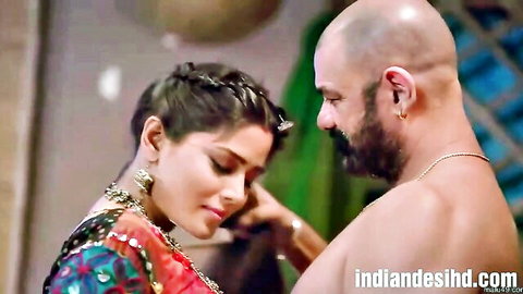 Indian babe in colorful saree caresses bald muscular hunk's face intimately
