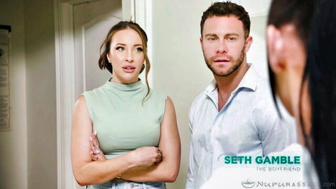 Brunette MILF arms crossed confronts Seth Gamble with friend in massage room threesome setup