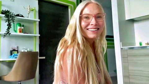Blonde step-mom with glasses smiles seductively in hot household tease