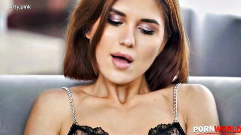 Young brunette with open mouth moaning in ecstasy wearing black lace lingerie top closeup