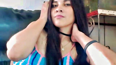 Melina Baut seductive pose in striped top and choker, long hair webcam tease