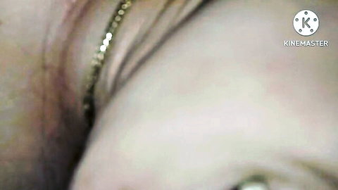 Closeup of woman's ecstatic orgasm face with thick cum dripping on cheek and lips
