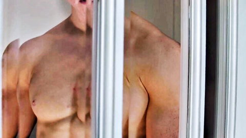 Muscular Alex Tanner peeking at Dacotah Red through door, shirtless gay tease