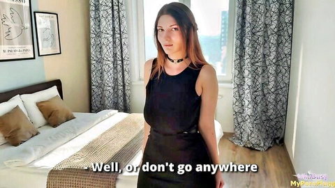 Busty redhead in tight black dress teasing with big tits in bedroom