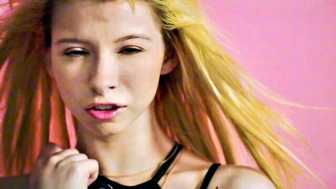 Blonde bombshell Kenzie Reeves with seductive pout and flowing hair