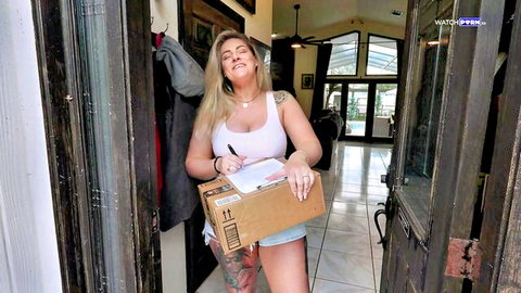Clover Baltimore as busty blonde housewife in tank top and shorts with delivery box