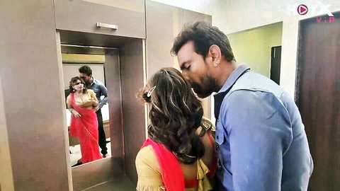 Indian Bhabhi in red saree kissed passionately by Devar from behind