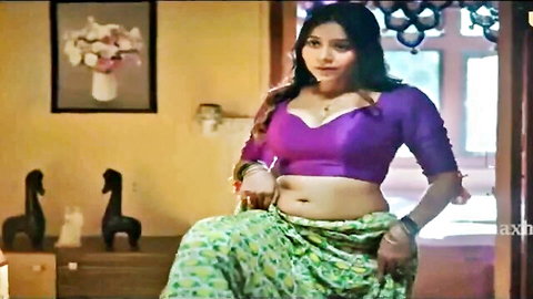 Seductive Indian brunette in tight purple blouse flaunting big tits cleavage and exposed navel