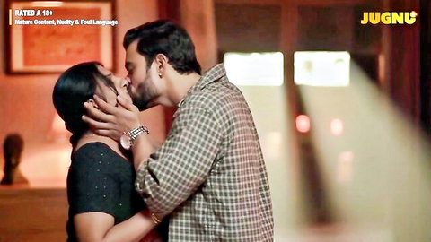 Sexy Indian brunette babe passionately kissing bearded hunk in steamy adult scene