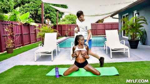 Ebony babe with big tits topless on yoga mat as white guy pulls her hair poolside